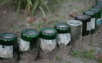 Why You Should Bury Glass Bottles In Your Garden