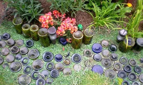 Why You Should Bury Glass Bottles In Your Garden