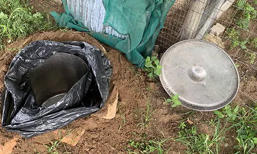 why you should bury a trash can in your backyard