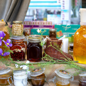 canned food, spices and honey on a table