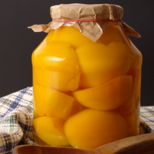 canned peaches in glass jar