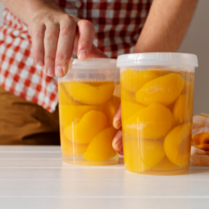 canned peaches in plastic jars