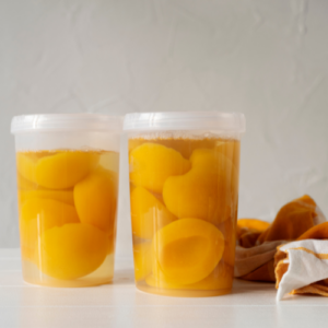 plastic jars of canned peaches