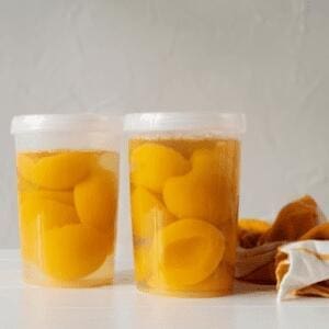 plastic jars of canned peaches