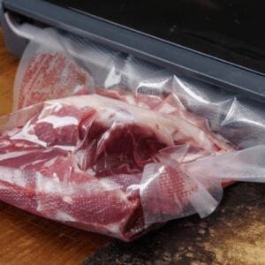 meat being vacuum sealed
