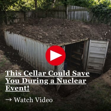 An underground cellar built into a dirt-covered shipping container with a red play button overlay and text that reads, This Cellar Could Save You During a Nuclear Event! Watch Video.