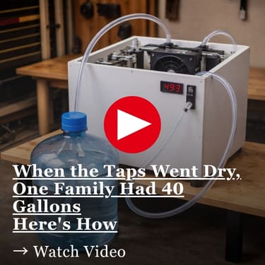 When the Taps Went Dry, One Family Had 40 Gallons Here's how omemade white prototype box on a wooden workbench with clear tubing connected to a large blue water jug in a workshop setting
