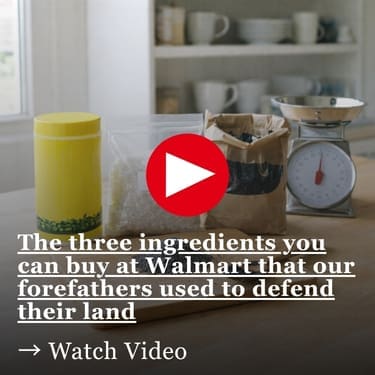 The three ingredients you can buy at Walmart that our forefathers used to defend their land On a bright kitchen counter, three plain containers sit behind a wooden board holding a small pile of dark gray powder and a spoon, with a kitchen scale to the side and blurred dishes on shelves in the background