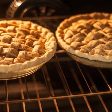 two apple pies in the oven