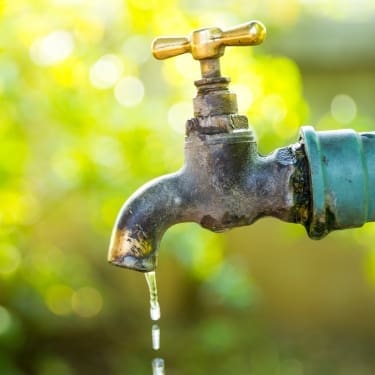 tap with water in the garden