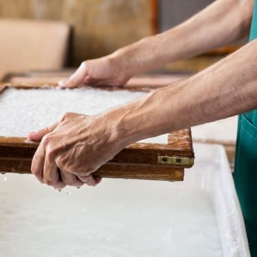 photo of someone making paper